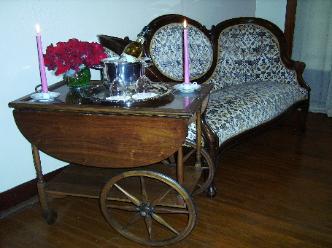 A fine sitting area with a server cart to relax by and enjoy some drinks in the ambiance of the Pelt room.  