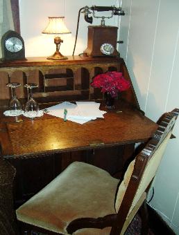 In the corner of Mama Pelt's Room you can relax with your cup of coffee while surfing the net on this beautiful vintage writing table.